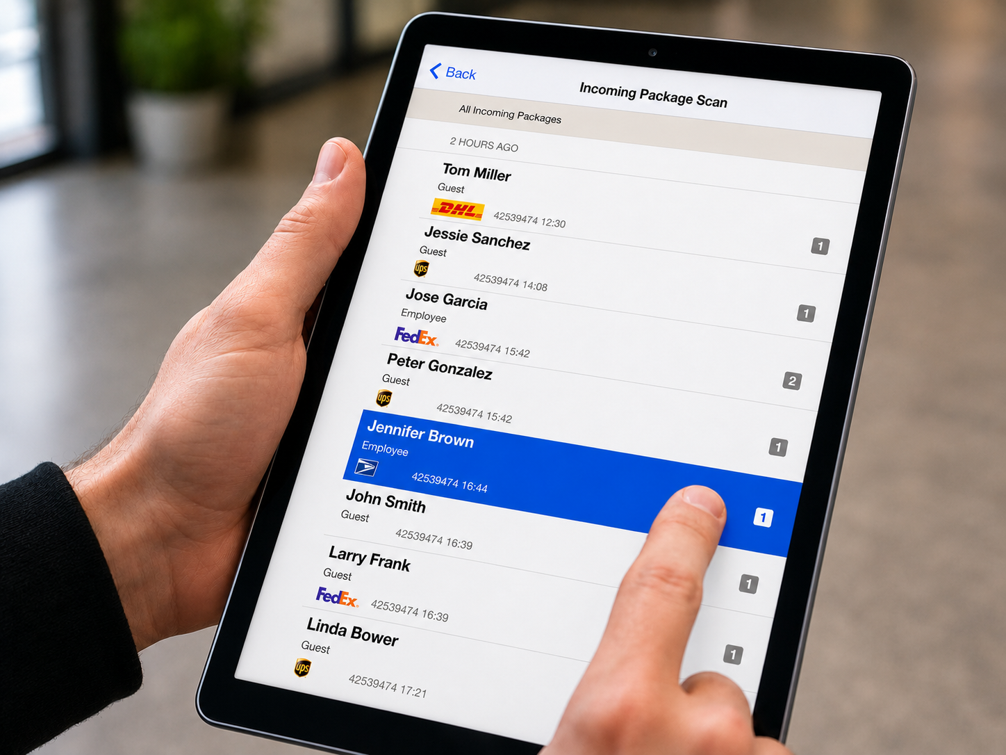 Incoming package list on a tablet showing recipients, carriers and timestamps